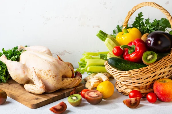 depositphotos_377486370-stock-photo-whole-raw-chicken-fresh-vegetables